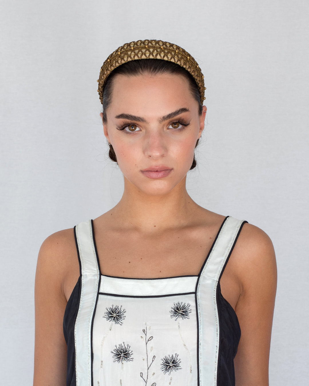 Mini gold headband in dupion silk with antique black metal trims and golden pearl embroidery, handmade in Vienna by Niely Hoetsch